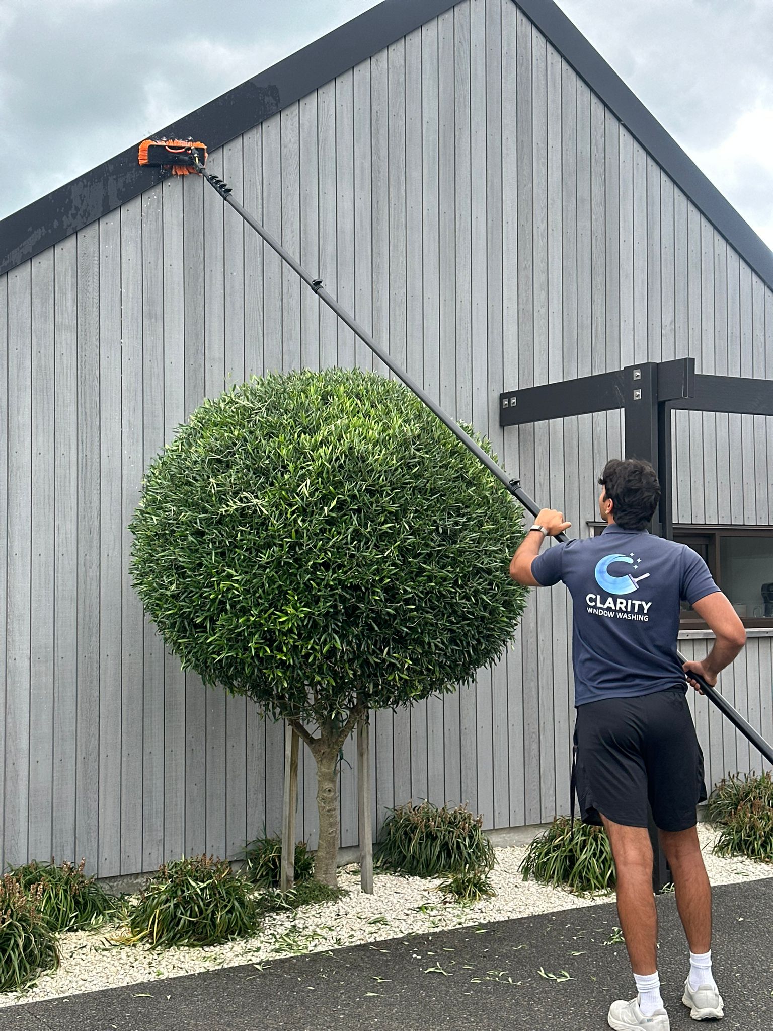 Close action shot of water-fed pole cleaning